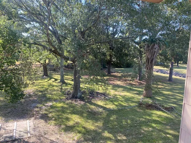 a backyard of a house with lots of green space