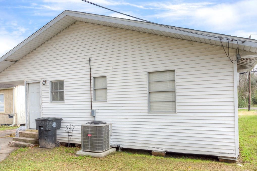 4859 Harrison Avenue Groves, TX 77619 - Photo 9 of 14 a view of backyard of house with outdoor seating