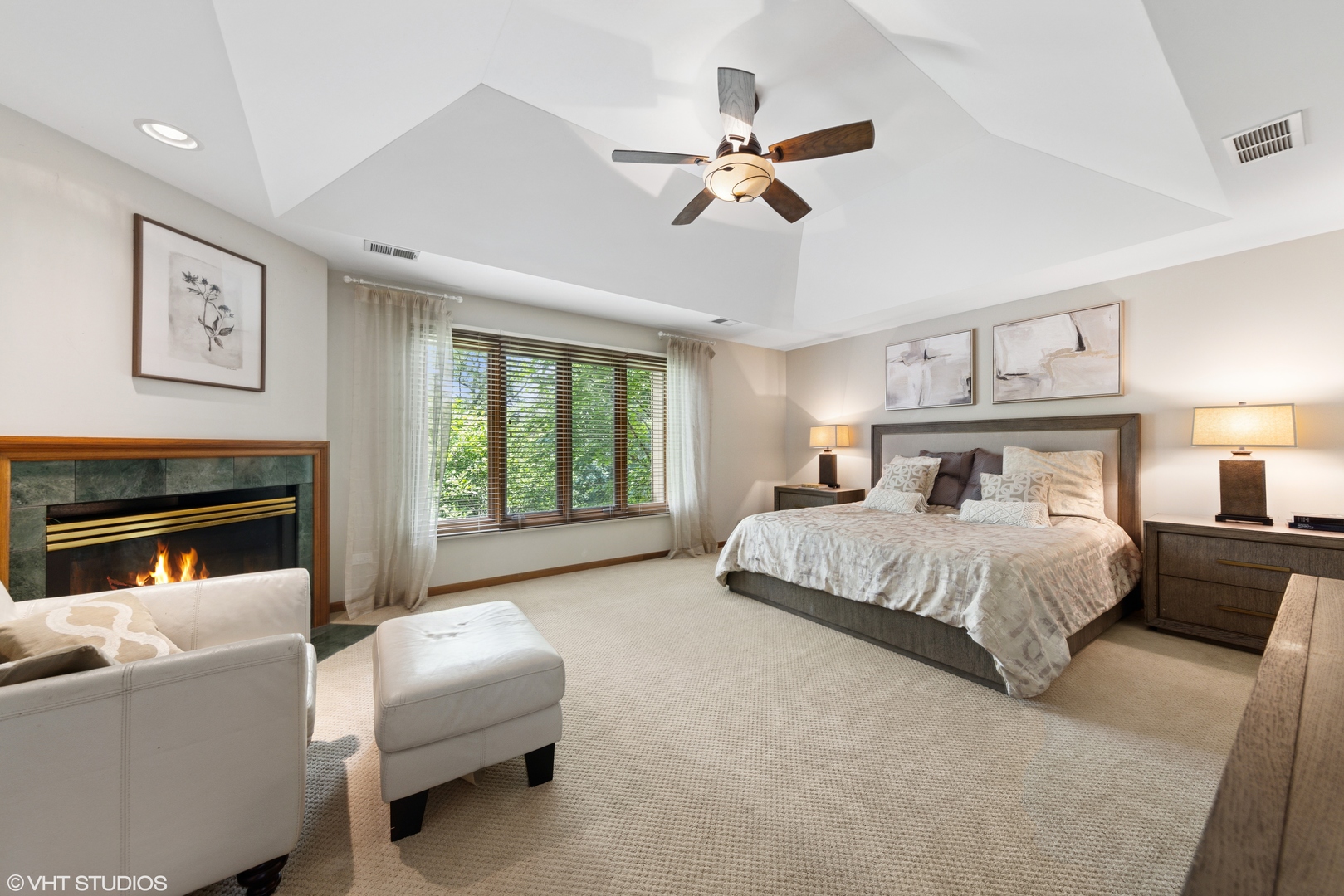 11522 Ridgewood Lane Burr Ridge, IL 60527 - Photo 17 of 47 a bed room with furniture and a fireplace
