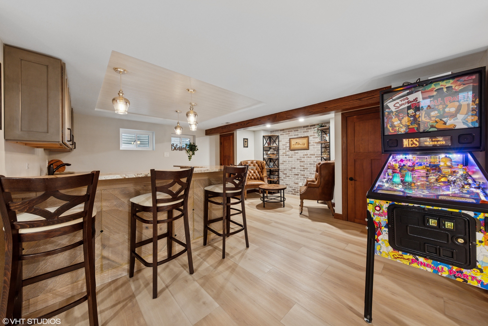 11522 Ridgewood Lane Burr Ridge, IL 60527 - Photo 32 of 47 a view of a dining room with furniture and a flat screen tv