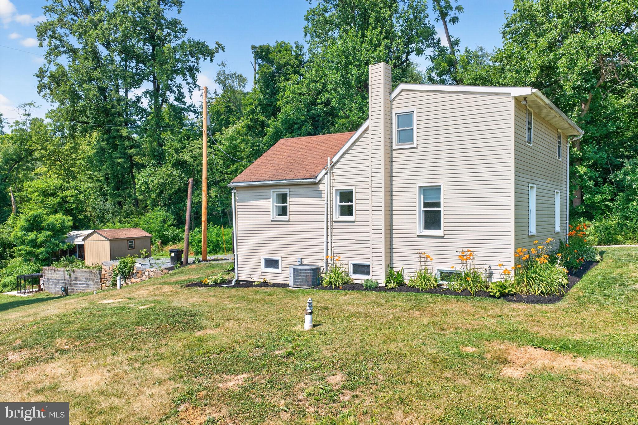 140 Limekiln Road Reading, PA 19606 - Photo 6 of 37 a view of a house with backyard and trees