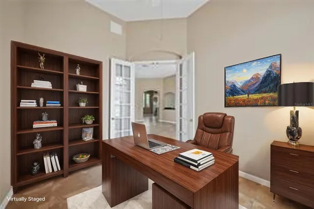 a living room with furniture and a bookshelf