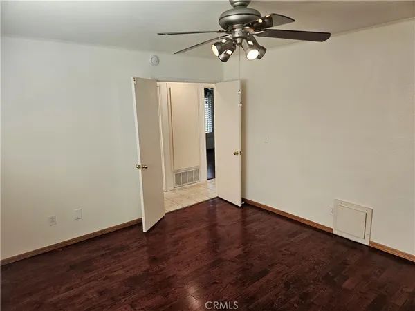 a view of room with hardwood floor