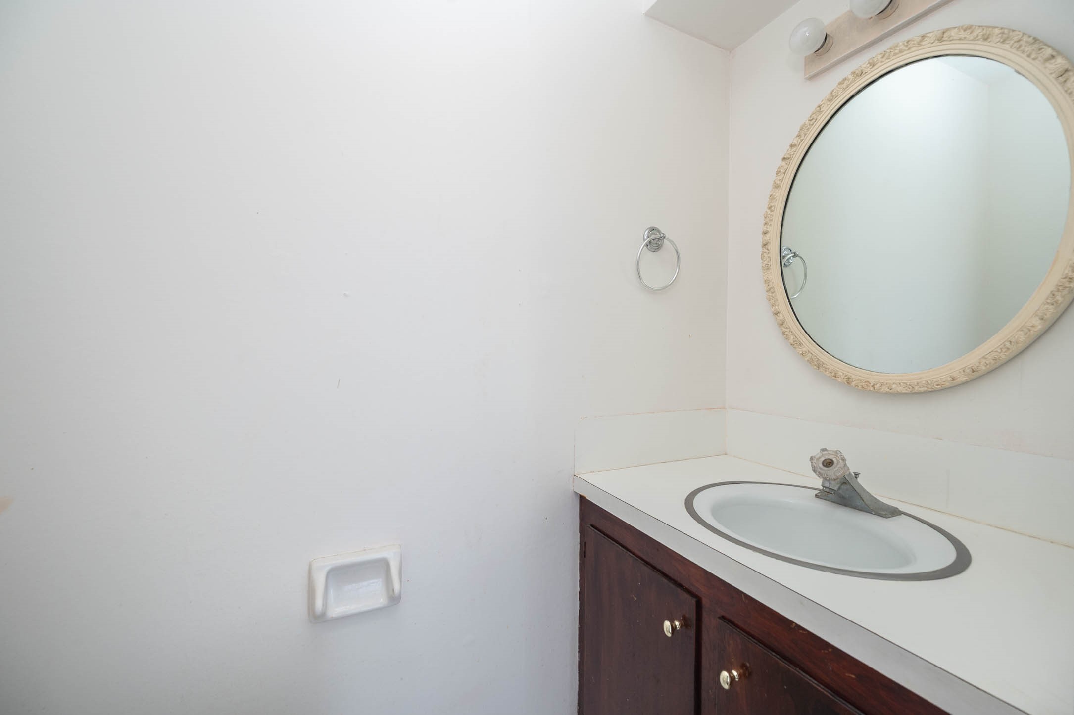1609 Mapleton Drive Houston, TX 77043 - Photo 11 of 21 a bathroom with a sink and a mirror