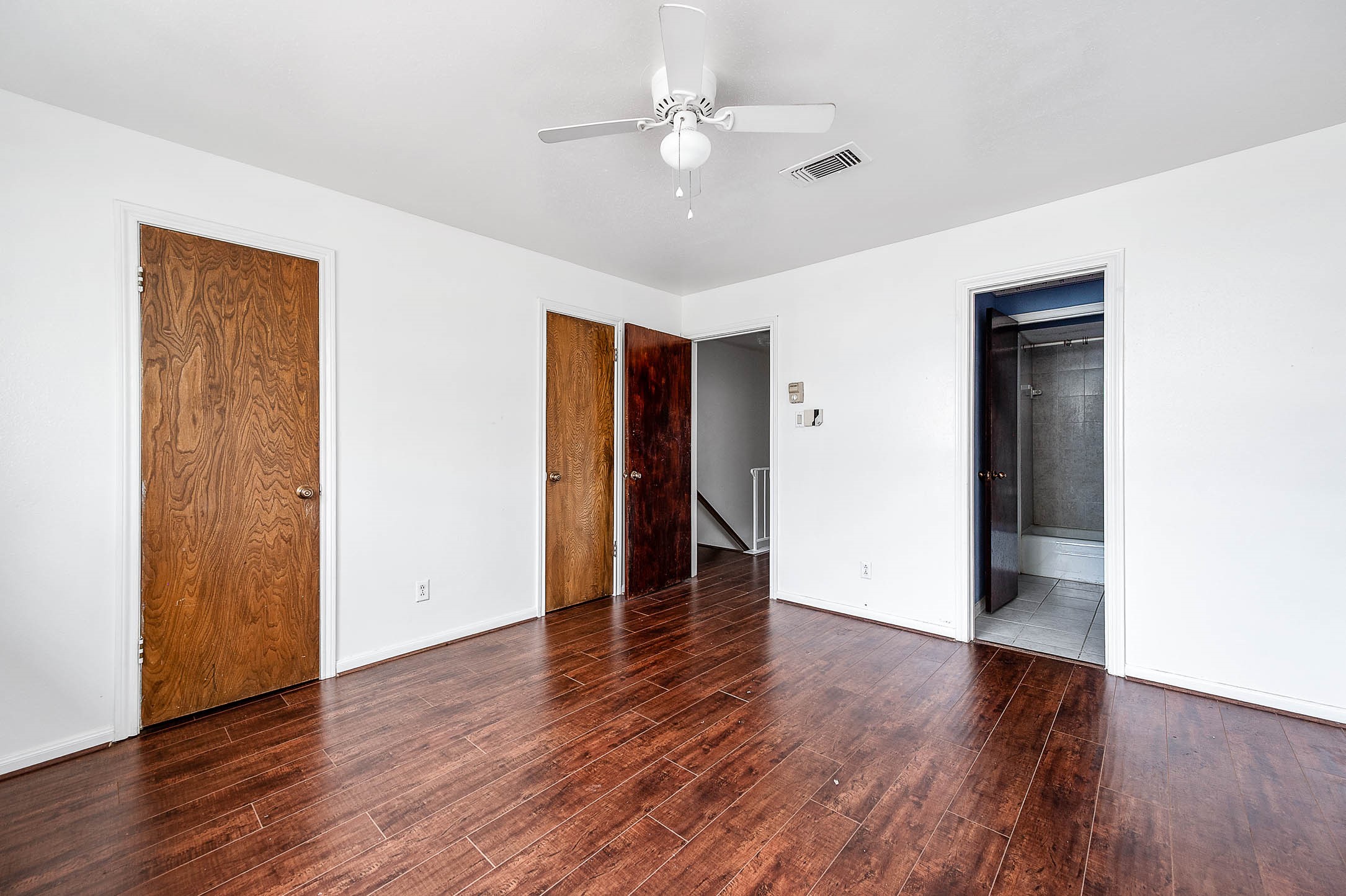 1609 Mapleton Drive Houston, TX 77043 - Photo 14 of 21 a view of an empty room with wooden floor