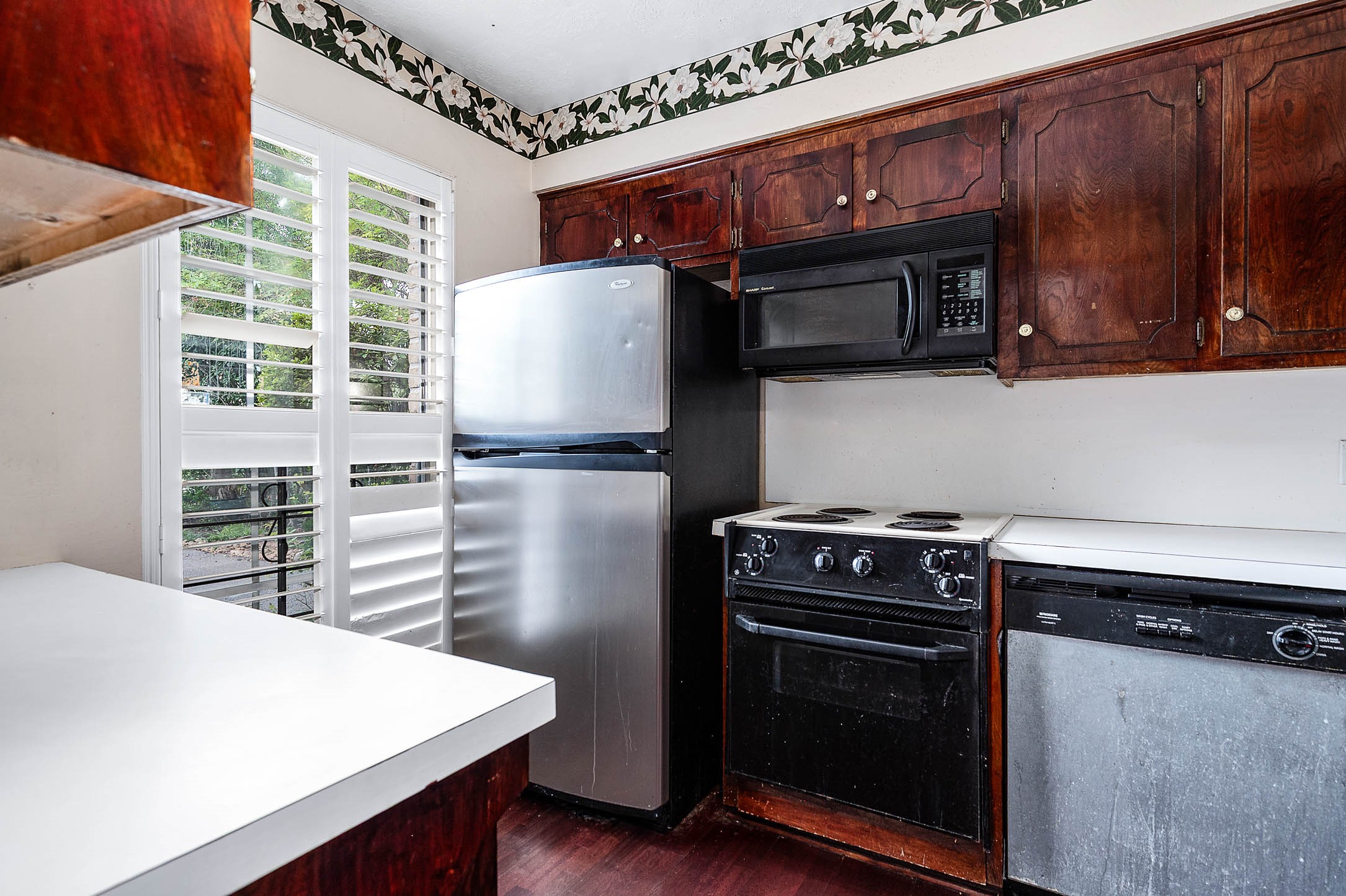 1609 Mapleton Drive Houston, TX 77043 - Photo 6 of 21 a kitchen with a stove and a microwave