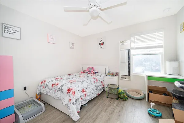 a bedroom with a bed and a table