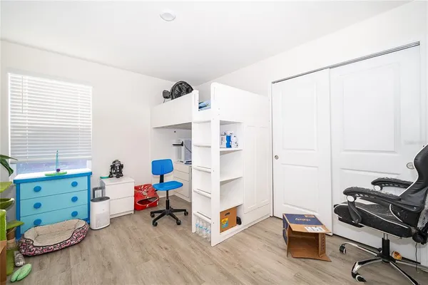 a workspace with furniture and a wooden floor