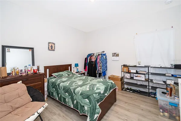 a bedroom with a bed and furniture