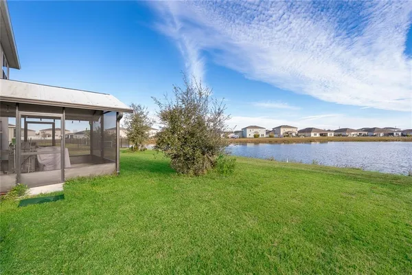 a view of a house with a yard and a garden