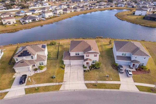 an aerial view of a house with a swimming pool