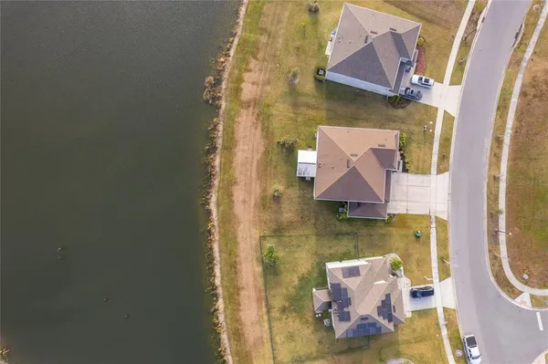an aerial view of a house with a swimming pool