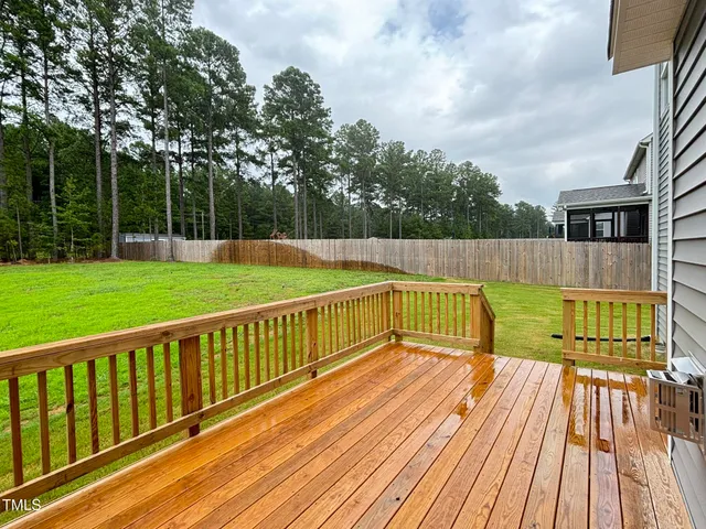 a view of a balcony with wooden floor