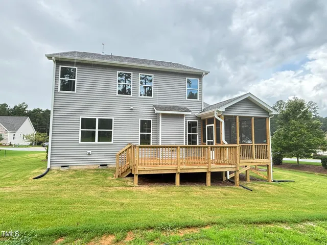 a view of balcony with wooden floor and fence