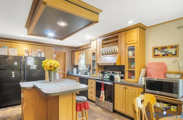 a kitchen with a sink and a refrigerator