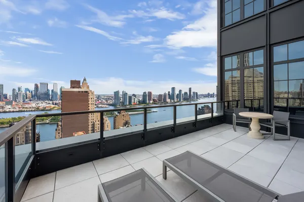 a view of a terrace with wooden benches