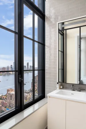 a bathroom with a mirror and a sink