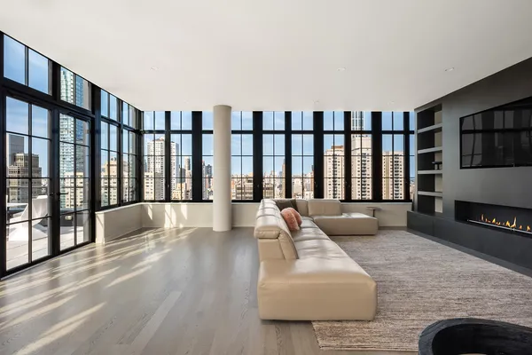 a living room with furniture fireplace and flat screen tv