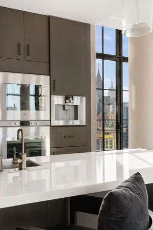 a kitchen with stainless steel appliances a sink and a microwave