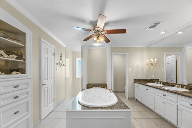 a bathroom with a sink a vanity and a mirror
