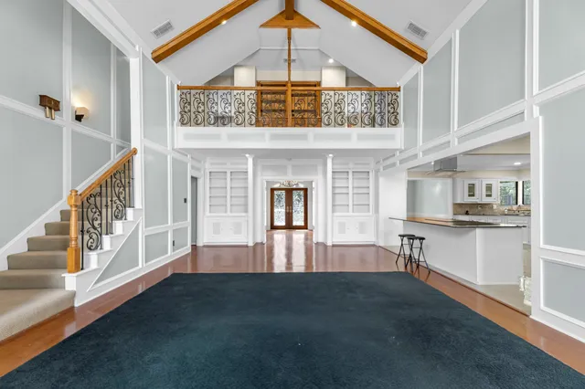 a view of living room with furniture and flat screen tv