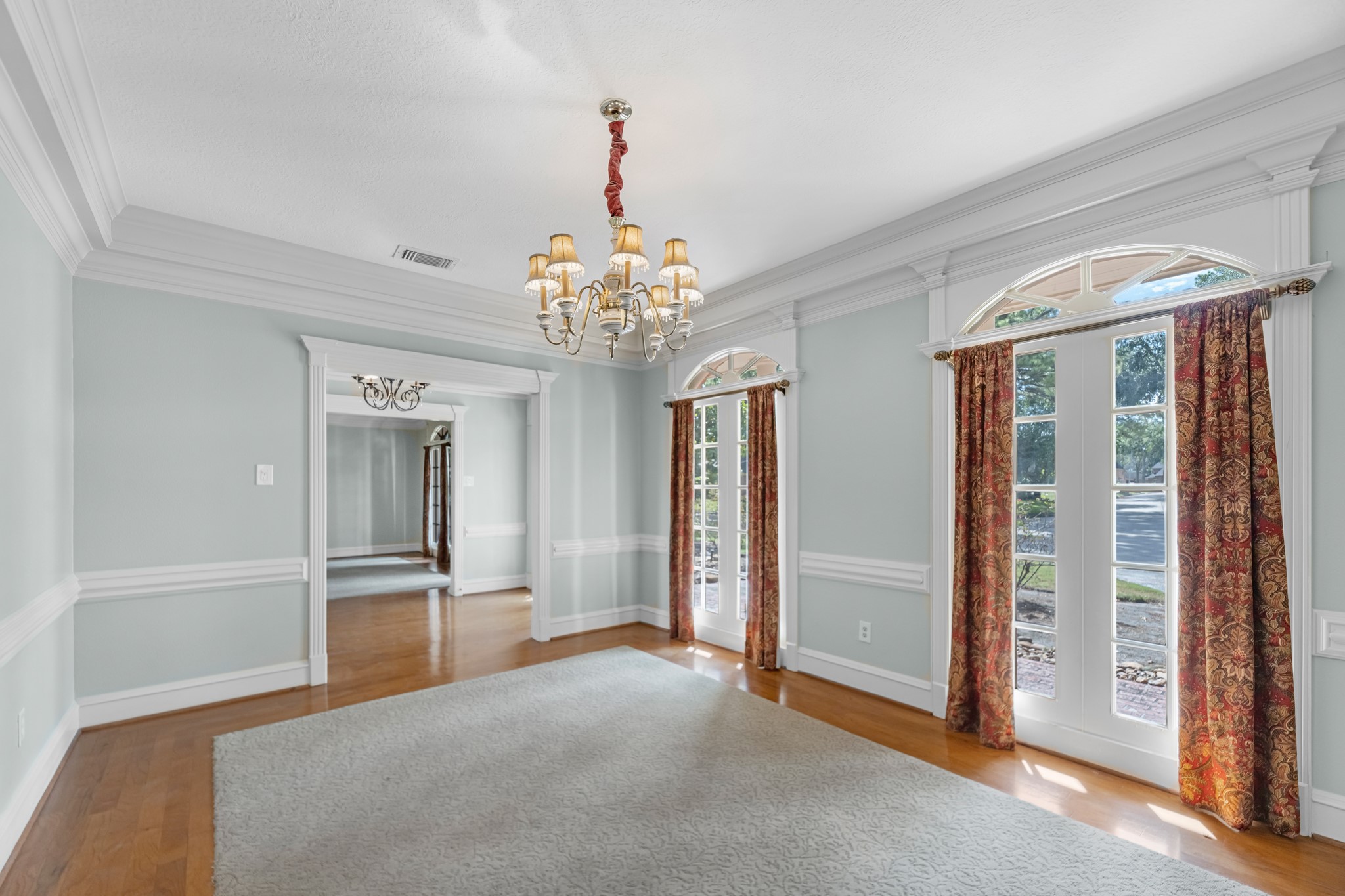 16114 Kempton Park Drive Spring, TX 77379 - Photo 6 of 22 a view of a big room with chandelier front door and windows