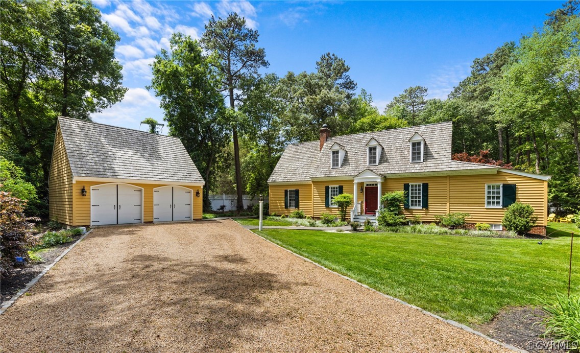 a front view of house with yard and green space