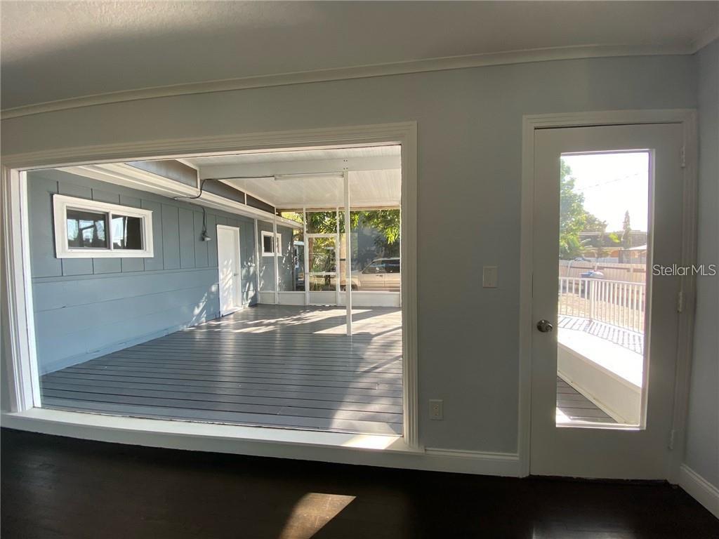 16 Jeff Road Largo, FL 33774 - Photo 11 of 14 a view of dining room and wooden floor