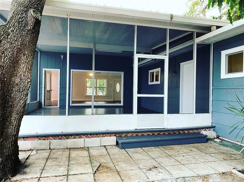 16 Jeff Road Largo, FL 33774 - Photo 14 of 14 a view of a building with a door and a window