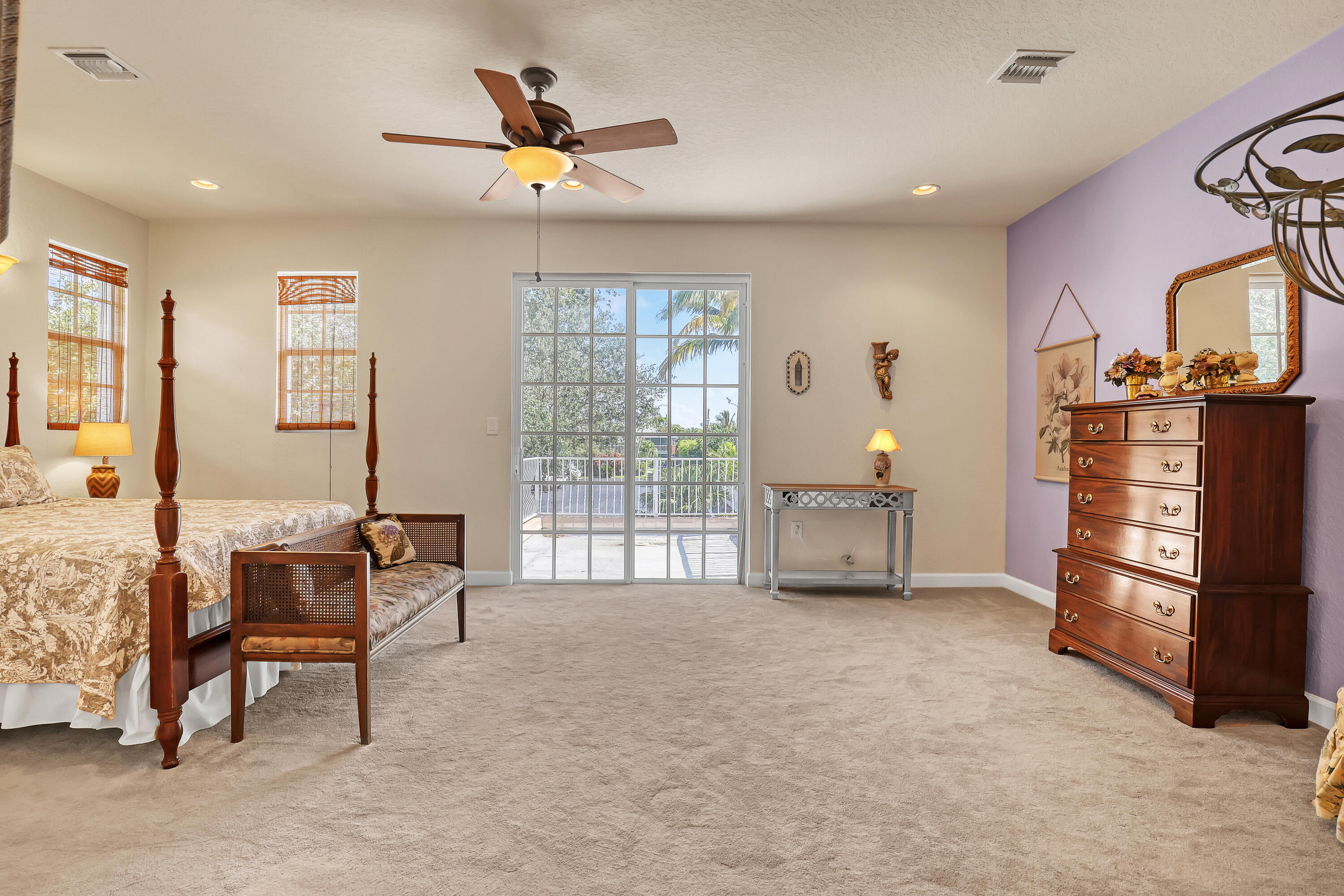 2560 Northeast 11th Street Pompano Beach, FL 33062 - Photo 9 of 18 a living room with furniture a ceiling fan and a window