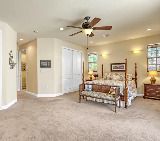 a view of a livingroom with furniture and a ceiling fan