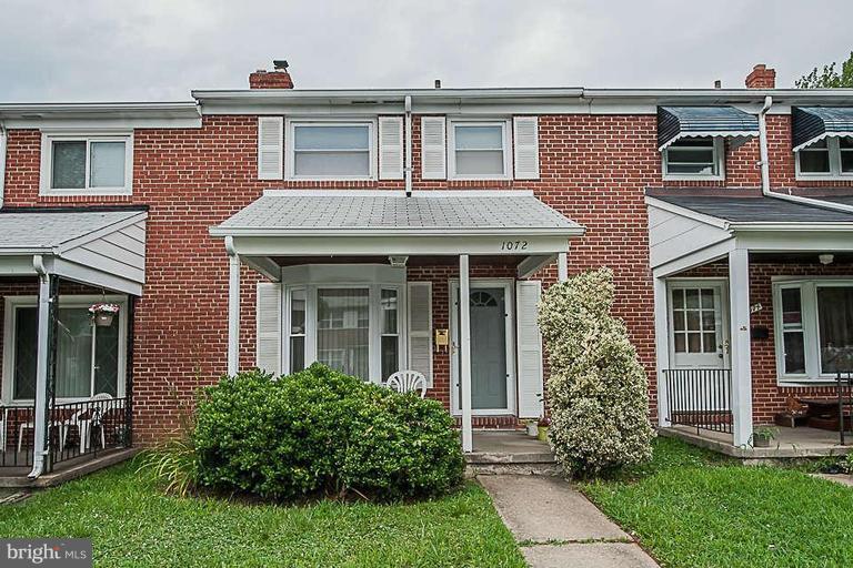 1072 Craftswood Road Baltimore, MD 21228 - Photo 1 of 18 front view of a house with a yard