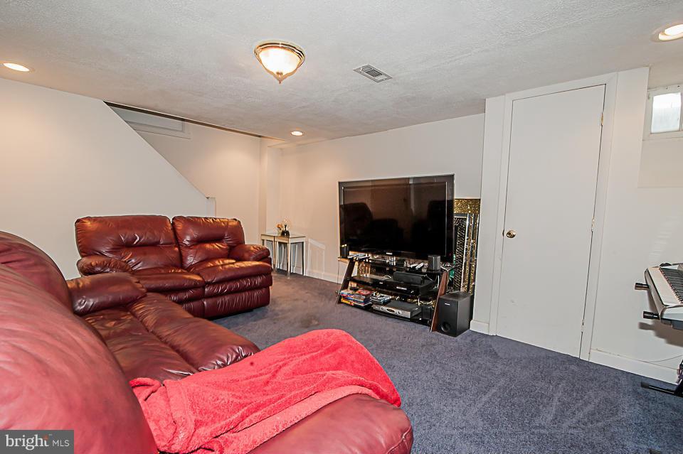 1072 Craftswood Road Baltimore, MD 21228 - Photo 14 of 18 a living room with furniture and a flat screen tv
