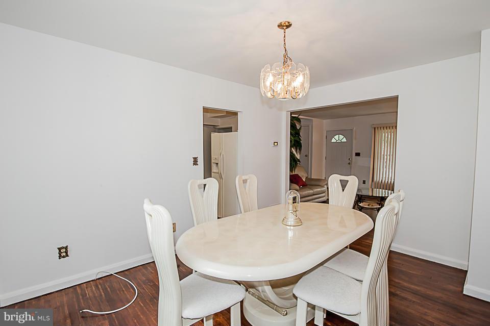 1072 Craftswood Road Baltimore, MD 21228 - Photo 7 of 18 a view of a dining room with furniture and wooden floor