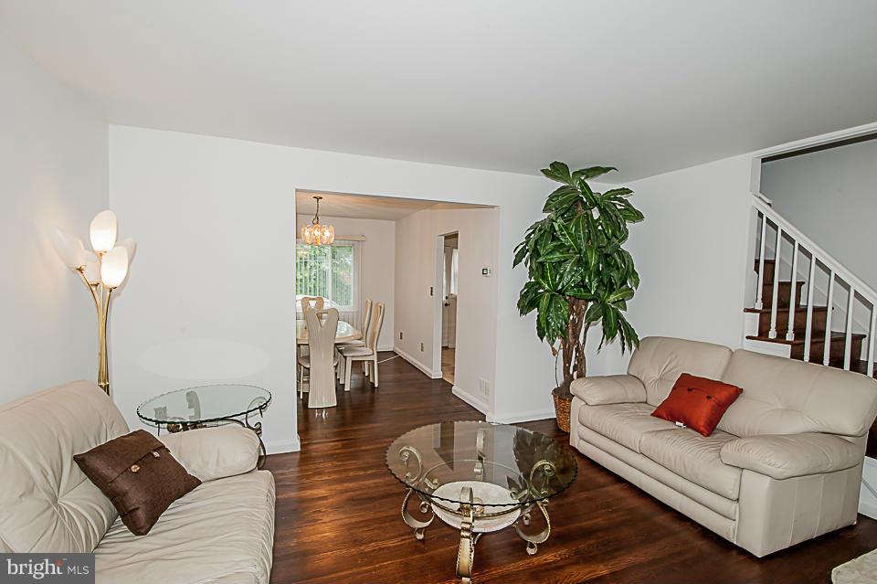 1072 Craftswood Road Baltimore, MD 21228 - Photo 8 of 18 a living room with furniture and a potted plant