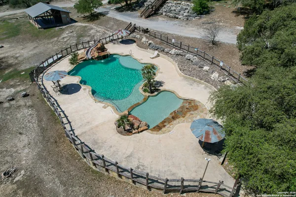 an aerial view of a house with outdoor space