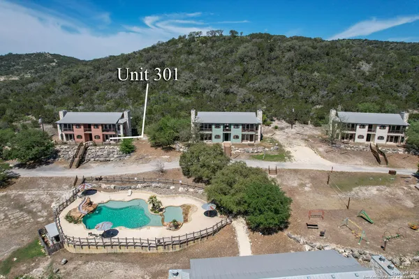 an aerial view of a house with outdoor space