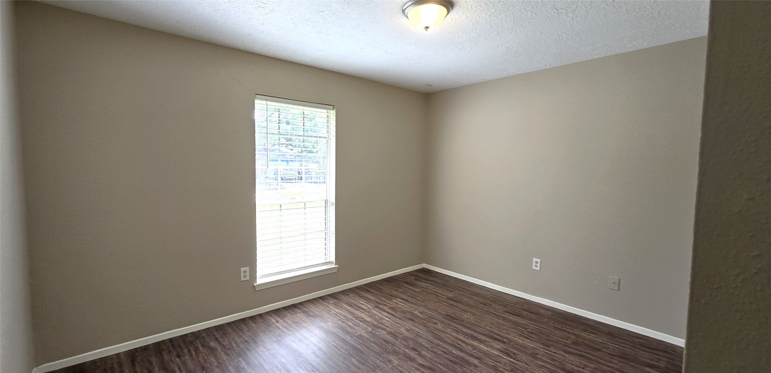 23019 Tree Bright Lane Spring, TX 77373 - Photo 12 of 20 Bedroom 2 includes a closet and a nice window providing the room with lots of natural light.