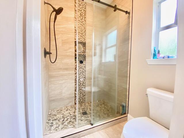4401 Windrush Drive Niceville, FL 32578 - Photo 19 of 35 a bathroom with a shower and a toilet