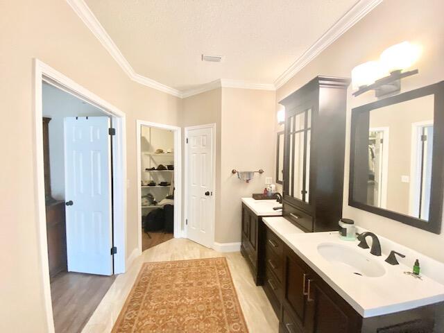 4401 Windrush Drive Niceville, FL 32578 - Photo 20 of 35 a spacious bathroom with a double vanity sink and a mirror