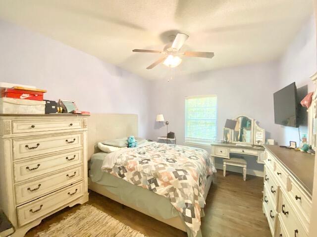 4401 Windrush Drive Niceville, FL 32578 - Photo 25 of 35 a bedroom with a bed and a flat tv screen on dresser