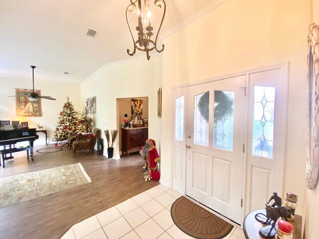 4401 Windrush Drive Niceville, FL 32578 - Photo 6 of 35 a living room with furniture and a chandelier