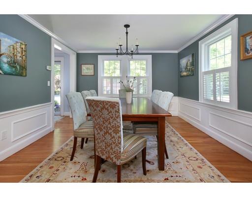 60 Arapahoe Road Newton, MA 02465 - Photo 6 of 13 a dining room with furniture a chandelier and wooden floor