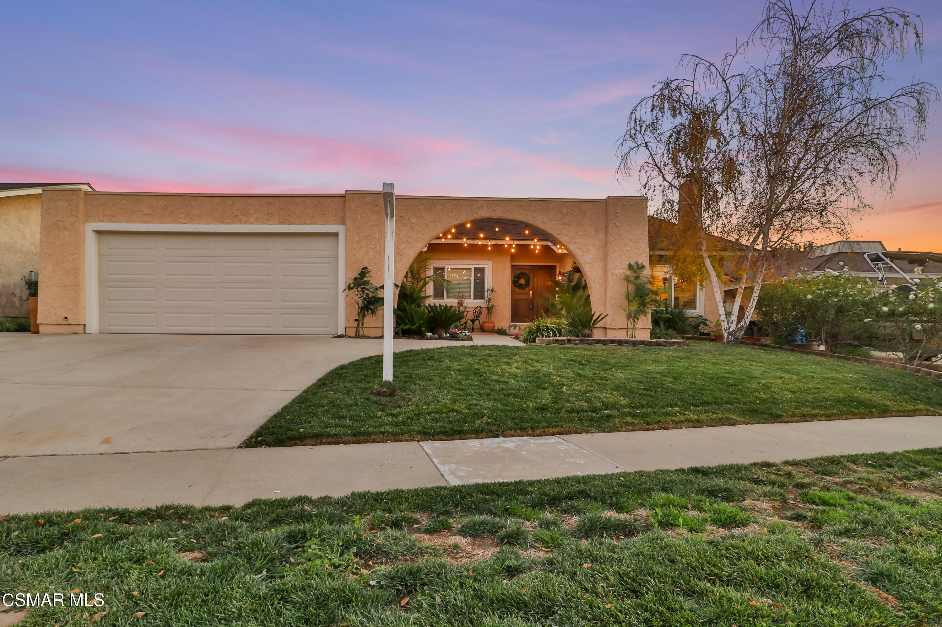5938 Serena Street Simi Valley, CA 93063 - Photo 2 of 76 a front view of a house with a yard and garage