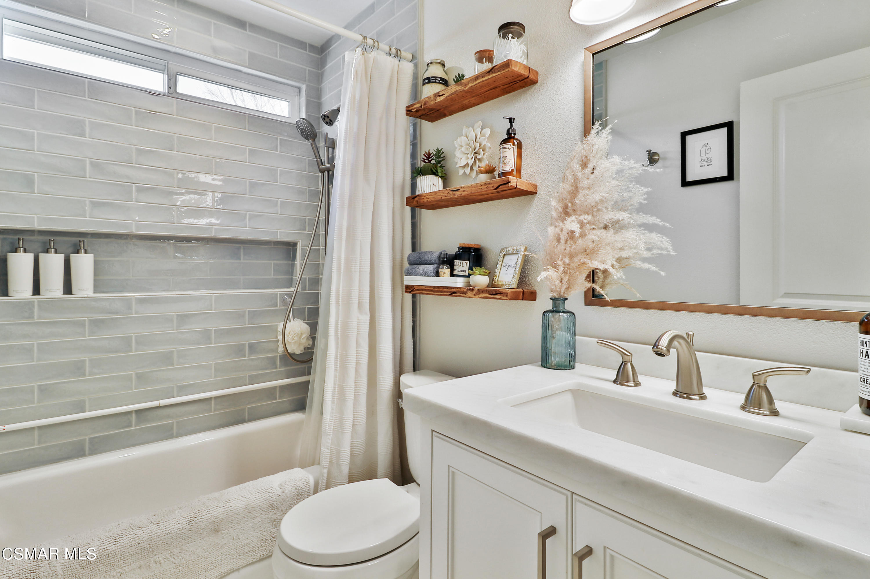 5938 Serena Street Simi Valley, CA 93063 - Photo 22 of 76 a bathroom with a sink a toilet and shower