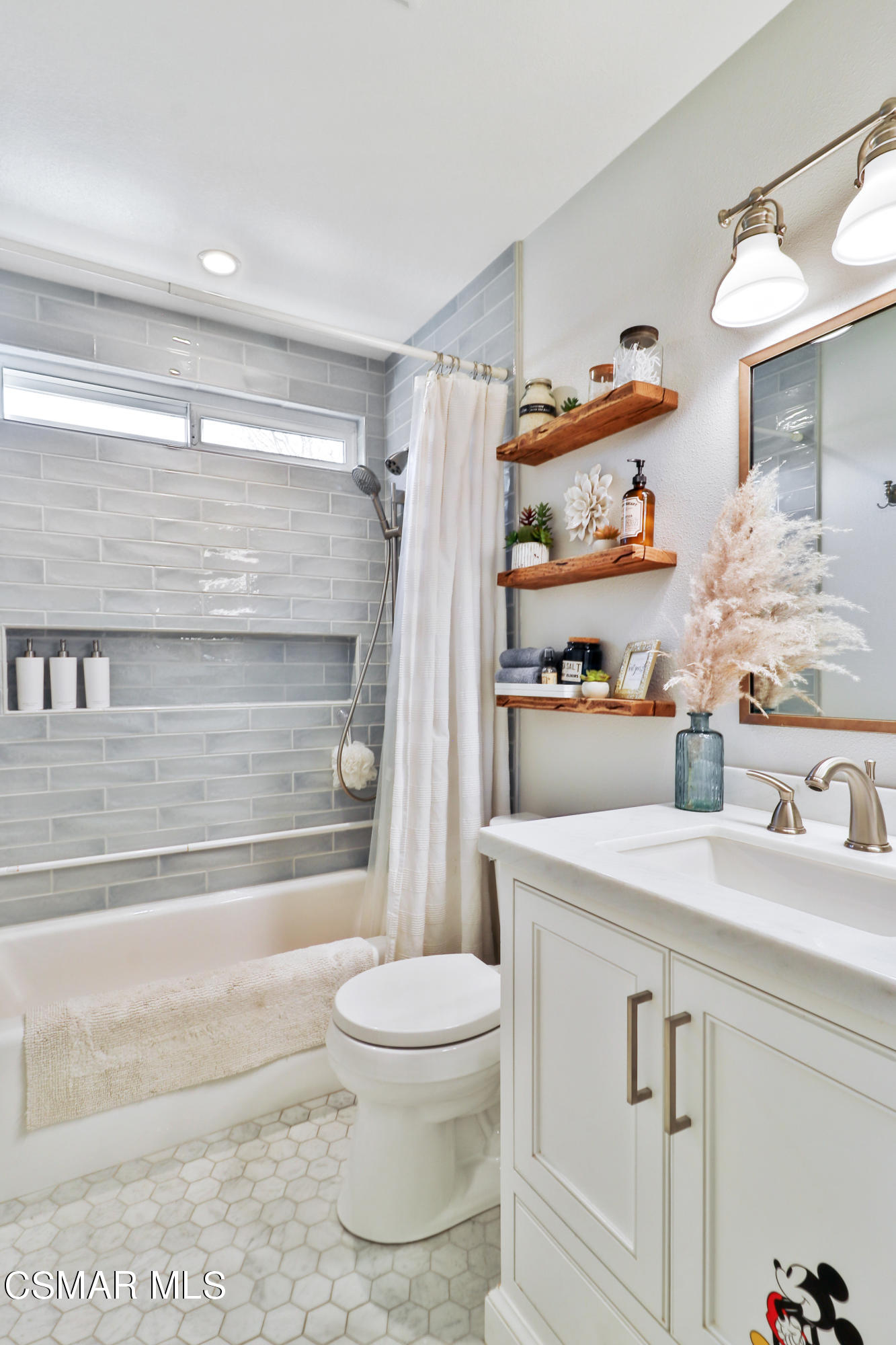 5938 Serena Street Simi Valley, CA 93063 - Photo 23 of 76 a bathroom with a sink a toilet and a shower