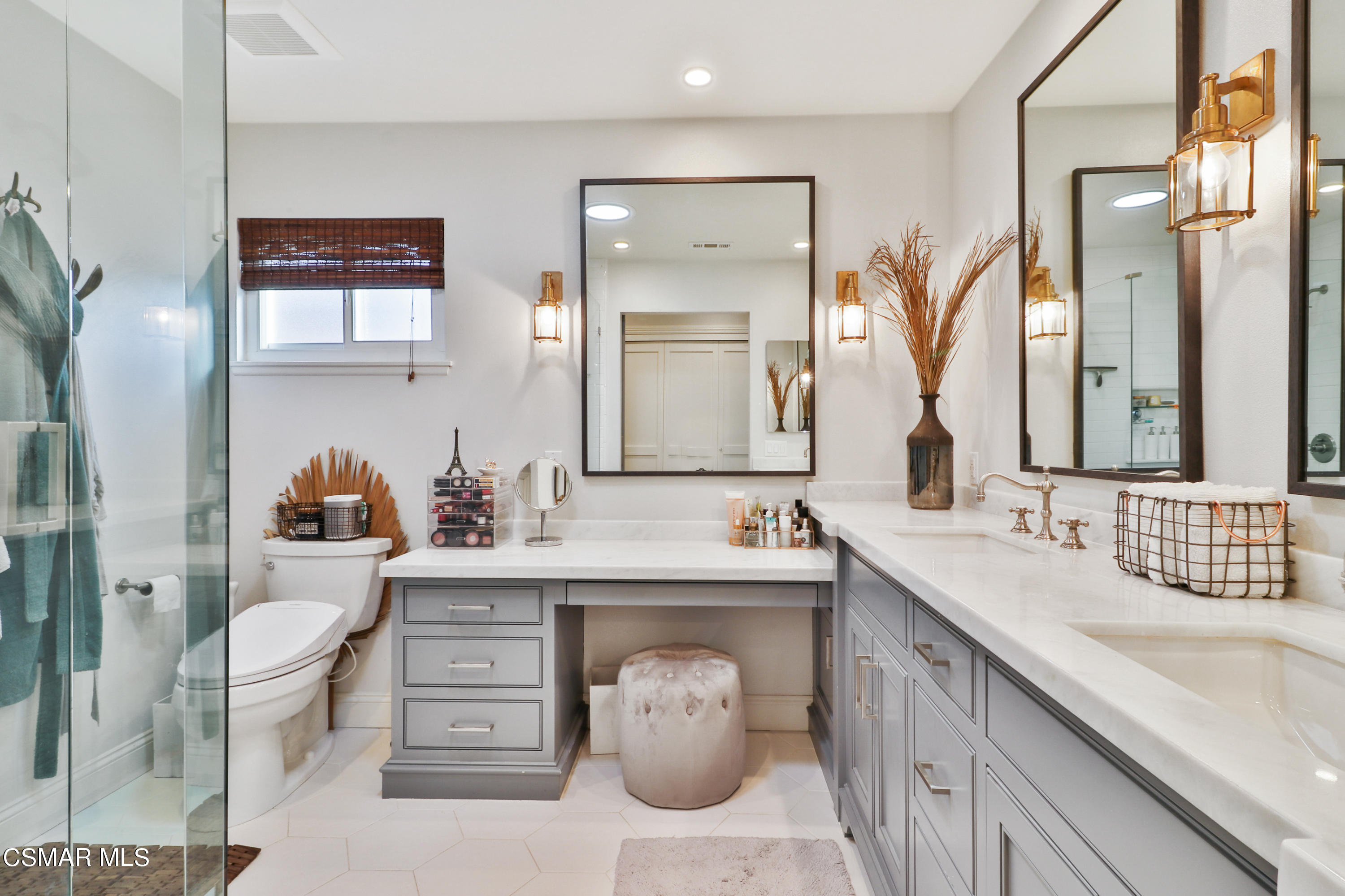 5938 Serena Street Simi Valley, CA 93063 - Photo 27 of 76 a bathroom with a toilet sink and mirror