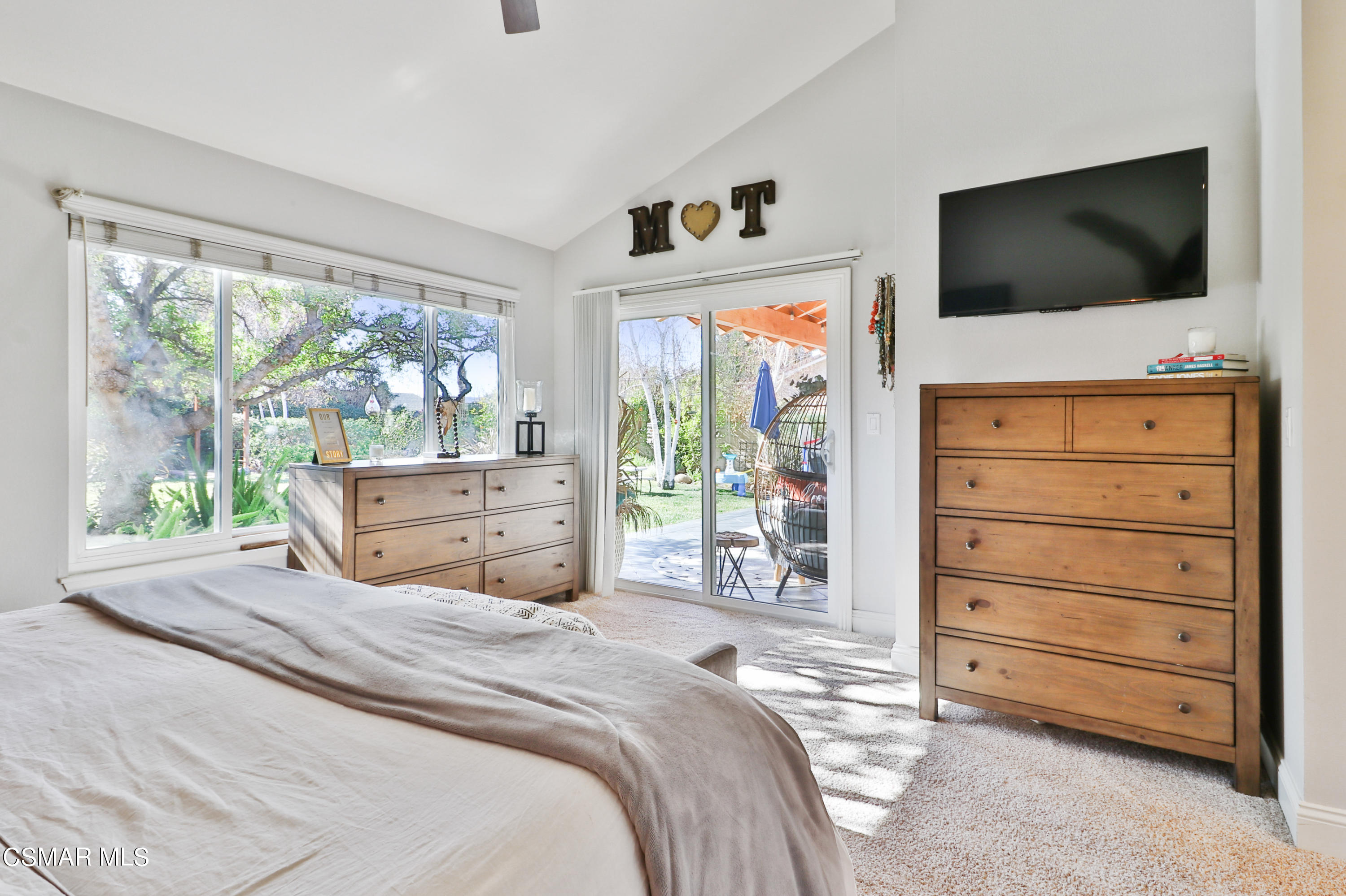 5938 Serena Street Simi Valley, CA 93063 - Photo 29 of 76 a bedroom with a bed and a flat screen tv