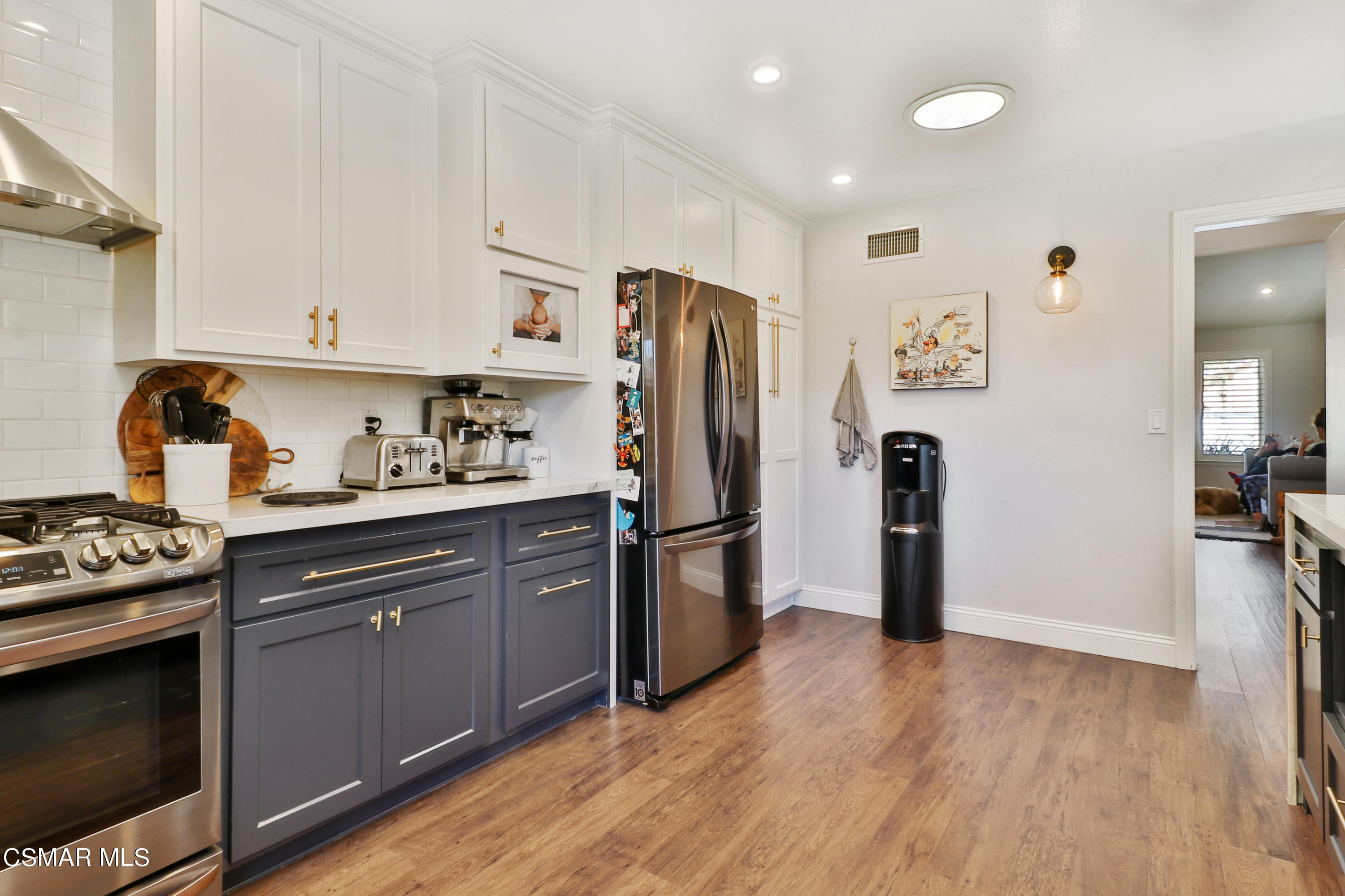 5938 Serena Street Simi Valley, CA 93063 - Photo 43 of 76 a kitchen with stainless steel appliances a refrigerator stove and sink