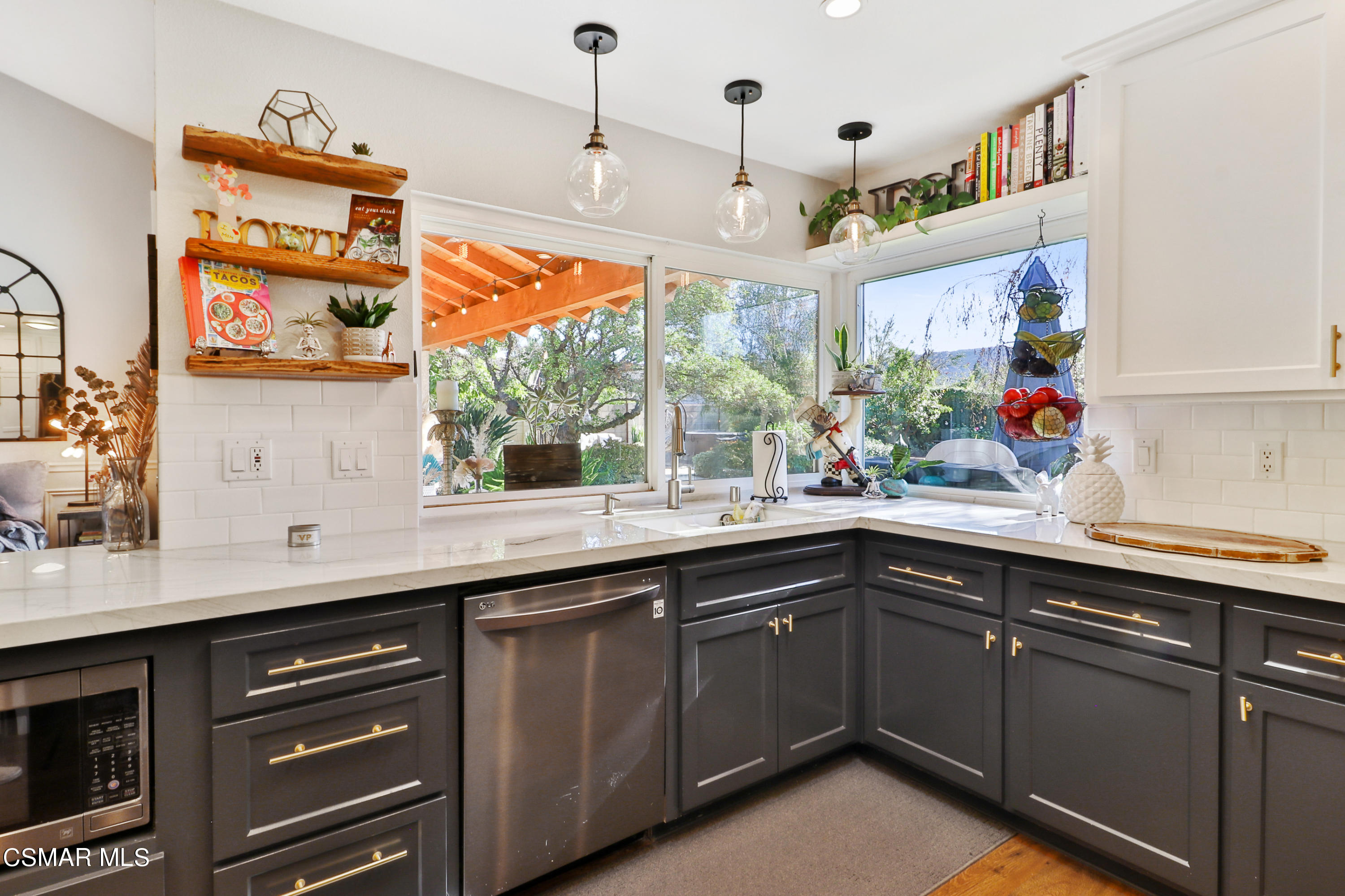 5938 Serena Street Simi Valley, CA 93063 - Photo 45 of 76 a kitchen with a sink window and cabinets